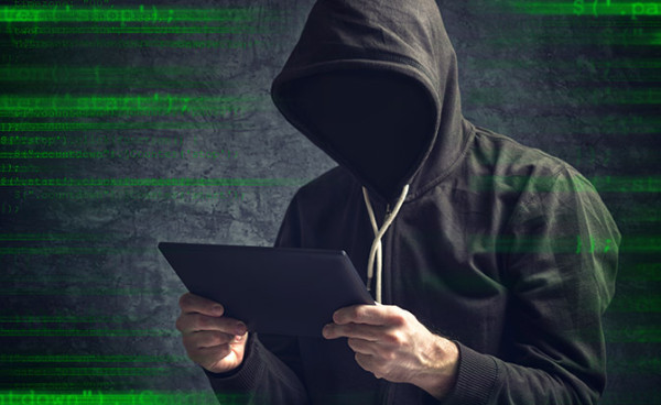 Faceless unknown unrecognizable anonymous man with digital tablet computer browsing internet.